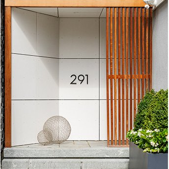 Modern entrance with wood paneling detail